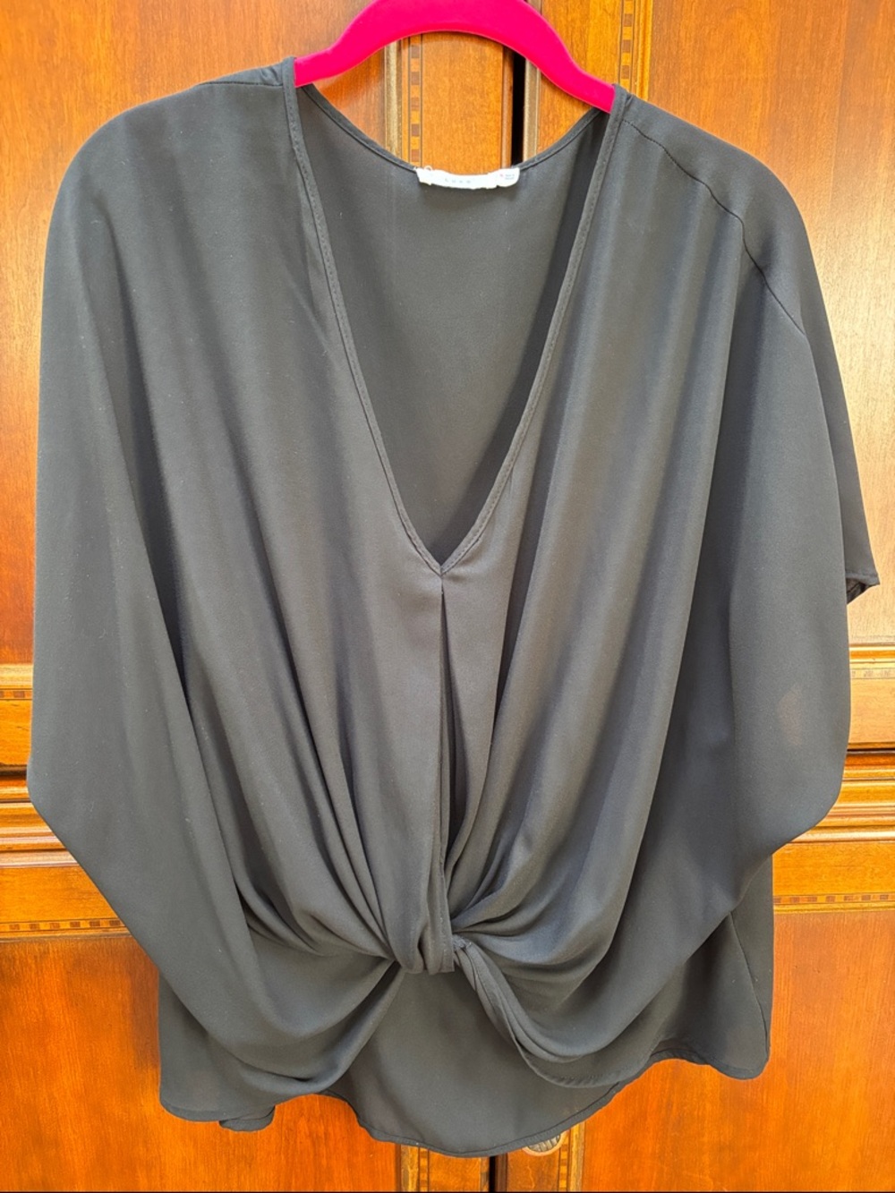 Lush twist front popover sleeveless blouse